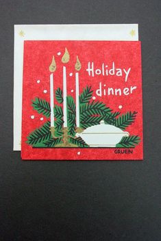 a holiday dinner card with candles on it