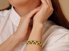 Brighten up your look with this handmade zigzag pattern bracelet, featuring Miyuki Delica beads in vibrant yellow and blue. The striking zigzag design adds a playful yet sophisticated touch to any outfit. The bracelet is crafted to a length of 16 cm (6.3 inches) with an extension chain, allowing it to fit wrists from 16 cm (6.3 inches) to 18 cm (7.1 inches). Perfect for adding a pop of color and style to your accessory collection. Materials: Miyuki Delica beads Waxed thread Features: Handmade wi Handmade Yellow Friendship Bracelets, Yellow Braided Friendship Bracelets, Yellow Friendship Bracelets With Round Beads, Yellow Friendship Bracelet, Pattern Bracelet, Bracelet Miyuki, Zigzag Design, Miyuki Delica Beads, Miyuki Bracelet