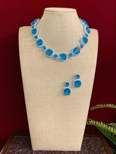 American diamond necklace . Premium crystal work . Comes with matching earring. Crystal Work, American Diamond Necklaces, Necklace Choker, American Diamond, Diamond Stone, Matching Earrings, Stone Necklace, Aqua Blue, Penny