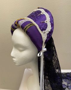 New women's Renaissance Medieval Elizabethan queen royal French Hood hat cap costume. This stunning purple brocade crown is embellished with gold and white filagree trim and pearl beading. Back black and purple brocade flowing veiling is 34" long. Ribbon ties for security. Inside combs also, to secure in place. Great addition for your special Renaissance gown, stage production or theme party. New not worn. Sales final. Medieval Costume Hats And Headpieces For Halloween, Medieval Halloween Costume Hats And Headpieces, Fitted High Crown Costume Hats And Headpieces, Mardi Gras Costume Headpiece With Tall Crown, Tall Crown Headpiece For Mardi Gras Costume, Tall Crown Costume Hats And Headpieces For Carnival, Fitted Costume Hat With Tall Crown, Fitted Costume Hats And Headpieces For Cosplay, Fitted Tall Crown Costume Hats