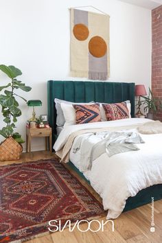 a bedroom with brick walls and a bed in the middle, surrounded by rugs