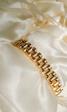 Beautiful gold statement bracelet for everyday or formal fashion! It is a strong design with a feminine size and style! This bracelet is beautiful layered or solo. We love the watch band inspiration - a modern take on traditional elements! Timeless Adjustable Gold Cuff Bracelet, Gold Cuff Bracelet, Tarnish Resistant For Formal Occasions, Gold Tarnish Resistant Cuff Bracelet For Formal Occasions, Timeless Gold Bracelets With Oyster Detail, Timeless Gold Metal Cuff Bracelet, Gold Tarnish-resistant Cuff Bracelet For Formal Occasions, Gold Timeless Oyster Bracelet, Gold Cuff Bracelet Jubilee Style For Formal Occasions, Gold Cuff Bracelet With Jubilee Detail For Formal Events