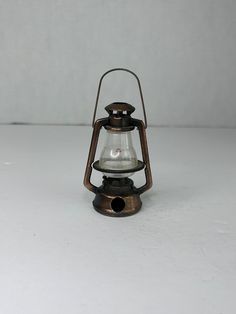 an old fashioned oil lamp on a white background