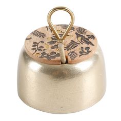 a small metal container with a wooden lid and handles on it's side, decorated with birds and leaves