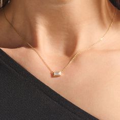 Elevate your style with our Minimal Baguette Necklace. The sleek baguette-cut pendant, suspended from a delicate gold chain, exudes timeless elegance. With its minimalist design and fine craftsmanship, this necklace effortlessly transitions from day to night, making it a versatile and refined addition to your collection. Whether worn solo or layered, it's a symbol of enduring beauty and impeccable taste. - Made in 14k solid gold - Decorated with handset white cubic zirconia stone on 14k solid go Sleek Gold Chain, Minimal Gold Pendant Design, Minimal Chain Necklace, Bagette Necklace, Minimal Pendant Necklace, Timeless Rectangular Necklace For Formal Occasions, Elegant Necklace With Rectangular Pendant And Cable Chain, Elegant Rectangular Pendant Necklace With Cable Chain, Elegant Bar Necklace With Cable Chain