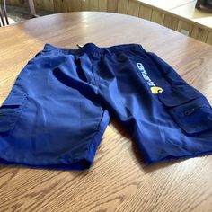 Brand New Pair Of Men’s Zipper Pocket Hiking Athletic Shorts With Carhartt Logo, Color Navy. Size Says Xl However They Fit More Like A Small To Medium. Blue Utility Bottoms For Outdoor Activities, Blue Outdoor Bottoms With Multiple Pockets, Outdoor Blue Bottoms With Multiple Pockets, Blue Bottoms With Multiple Pockets For Outdoor, Sporty Bottoms With Pockets For Camping, Casual Camping Bottoms With Multiple Pockets, Casual Camping Bottoms With Pockets, Blue Shorts With Multiple Pockets, Sporty Camping Bottoms With Pockets