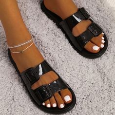 Never Worn Black Flat Flip Flops For Summer, Black Flat Sandals For The Beach, Black Flat Sandals For Beach, Trendy Synthetic Flip Flops With Buckle Closure, Summer Black Sandals With Buckle Closure, Trendy Open Toe Flip Flops With Buckle Closure, Trendy Open Toe Flip Flops With Buckle, Black Flip Flops For Beach, Black Slip-on Synthetic Jelly Sandals