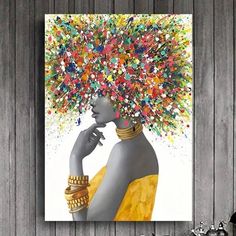 a painting on a wall with a woman's head covered in colorful sprinkles