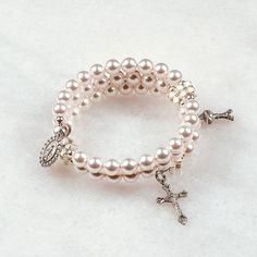 White Flower First Communion   Hand-crafted rosary bracelets   https://ourladysrosegarden.com/product/white-flower-first-communion-rosary-bracelet #RosaryBracelets Cheap Silver Beads Rosary Bracelet As Gift, Cheap White Jewelry For First Communion, Elegant Pearl Rosary Bracelet For Baptism, Pearl Charm Jewelry For First Communion, Elegant Pearl Jewelry For Confirmation, First Communion Pearl Drop Jewelry, Pearl Rosary Bracelet For Weddings, Pearl Charm Bracelet For First Communion, White Pearl Charm Jewelry For First Communion