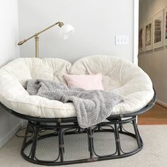 a white chair sitting on top of a wooden floor