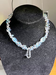 Hello and welcome to my store! Up for sale here is a crystal and glass beaded necklace. The beads are clear with hints of the rainbow in them and the crystals are clear. This necklace is gorgeous and would be a perfect gift for the woman in your life. It measures about 17 inches long and closes with a silver lobster claw clasp. Thanks for looking! Beaded Teardrop Crystal Necklace, Crystal Necklaces With Round Gemstone Beads, Clear Crystal Necklaces With Round Beads For Gifts, Clear Crystal Necklace With Round Beads For Gifts, Clear Crystal Necklace With Round Beads As A Gift, Handmade Crystal Jewelry In Clear, Handmade Clear Crystal Jewelry, Handmade Clear Crystals For Jewelry Making, Crystal Beaded Teardrop Necklace