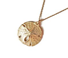 Gold Sand Dollar Jewelry Ocean Jewelry Trending Jewelry by AliCArt Beach Pendant Jewelry With Engraving, Beach Engraved Pendant Jewelry, Engraved Pendant Necklace For Beach, Yellow Gold Starfish Charm Jewelry For Beach, Ocean-inspired Yellow Gold Beach Jewelry, Ocean-inspired Gold Round Pendant Jewelry, Gold Ocean-inspired Round Pendant Jewelry, Ocean-inspired Round Gold Necklace, Gold Round Pendant Jewelry For The Beach