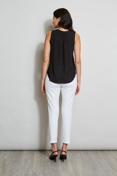 Luxurious Georgette elevates this minimalist top. Its split neckline and soft shoulder pleat detail add a touch of feminine flair. This essential piece will take you from Spring into Fall. T-Tahari Sleeveless Split Neck Georgette Shirt Relaxed Fit; Runs true to size. Model is 5'9" and wearing size S Imported Style #: THF41048 Sleeveless Blouse For Business Casual, Sleeveless Business Casual Blouse, Versatile Sleeveless Top For Business Casual, Versatile Sleeveless Viscose Blouse, Viscose Sleeveless Blouse Tank Top For Work, Sleeveless Viscose Tank Top For Work, Flattering Sleeveless Tops, Elegant Sleeveless Tops For Business Casual, Sleek Sleeveless Summer Blouse