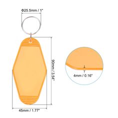 an orange plastic keychain with a metal ring on the front and bottom side