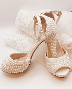 Simply Beautiful Hand Finished Ivory Pearl Embellished Open Toe Wedding Sandals with Ankle Strap and Platform Front Very Elegant Slight Platform for Added Comfort Perfect Wedding Day Shoe High for Elegance Perfect for Comfort Sizes: UK 3-7 (EU 36-41) Elegant Open Toe Heels With Pearl Embroidery, Wedding Heels With Pearl Embroidery And Open Toe, Cream Open Toe Sandals For Bridal Shower, Cream Closed Toe Sandals For Wedding, White Embellished Heels For Wedding Reception, Formal White Heels With Pearl Embroidery, Formal White Wedding Shoes With Pearl Embroidery, White Heels With Pearl Embroidery For Formal Occasions, Elegant Cream Wedding Shoes With Pearl Embroidery