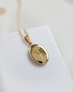 Material: 14K Solid Gold, Gold Filled, Sterling Silver- The chain material matches the same material as the locket.Locket Size: 19mm x 10mm (small)This locket is small and dainty. Please check sizing before ordering.Delicate chain 1mm smooth. The chain material matches the material of the locket.To add photos:- Inside allows you to glue 2 photos- https://www.etsy.com/listing/953533698/locket-photos-add-on-only?ref=shop_home_active_1&frs=1Add additional engraving:https://www.etsy.com/listing/ Dainty Oval Locket Necklace For Anniversary, Rose Gold Jewelry With Birth Flower For Memorial, Memorial Rose Gold Jewelry With Birth Flower, Elegant Locket Necklace With Flower Charm As Gift, Elegant Flower Charm Locket Necklace For Anniversary, Rose Gold Oval Jewelry With Flower Charm, Oval Rose Gold Jewelry With Flower Charm, Elegant Oval Locket Necklace For Anniversary Gift, Elegant Oval Locket Necklace For Anniversary