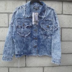 Y2k 80s 90s Acid Wahs Distressed Destroyed On Purpose Look Denim Jacket By Thrill Jeans Med #0369 Size: Med 21" Pit To Pit 21" Neckline To Hem 15" Sleeve Length--Dropped Sleeves Fabric: 100% Cotton Two Front Pockets (5) Metal Buttons Down The Front Item#0369-Blue Bins Jean Jacket Denim Jacket Acid Wash 80s Jacket Streetwear Heading To A Y2k Party, 80s 90s Or Halloween Party---This Is Right On Trend For The Party 100% Cotton New With Tags Grunge 90's Denim Distressed Denim Jackey Check Out My Clo Edgy Denim Jacket With Frayed Hem For Streetwear, Grunge Cotton Outerwear With Frayed Hem, Stonewashed Grunge Outerwear For Fall, Fall Grunge Stonewashed Outerwear, Fall Stonewashed Grunge Outerwear, Vintage Ripped Denim Jacket For Fall, Acid Wash Denim Jacket With Frayed Hem For Fall, Trendy Washed Blue Denim Jacket For Streetwear, Trendy Dark Wash Outerwear With Frayed Hem