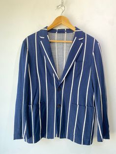 Tomorrowland Navy Striped Shirt & Jacket Set! 100% cotton. The jacket has a two-button front and single vent in the back. Unlined. Size medium, please refer to measurements. In excellent condition! Approx. Measurements: Shirt: U: 21" L: 25" Jacket: U: 20.5" A: 24" L: 26" Tailored Cotton Sport Coat With Button Closure, Striped Long Sleeve Blazer With Button Closure, Striped Long Sleeve Outerwear For Business Casual, Blue Cotton Blazer With Hidden Button Closure, Classic Cotton Outerwear With Suit Collar, Striped Blazer With Hidden Button Closure, Striped Blazer With Pockets And Lapel Collar, Striped Long Sleeve Blazer With Hidden Buttons, Tailored Cotton Outerwear With Suit Collar