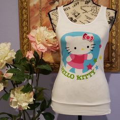 Adorable Hello Kitty Sleepwear Playful White Sleeveless Sleepwear, White Cartoon Print Sleep Top, Casual White Sleepwear With Character Print, Cute White Sleepwear With Character Print, Cute White Character Print Sleepwear, Casual Hello Kitty Print Tops For Sleepover, Playful Hello Kitty Print Sleepwear, Cute Cotton Stretch Sleepwear, Cute Stretch Cotton Sleepwear