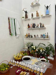 a room with shelves filled with figurines and bowls of food on the floor