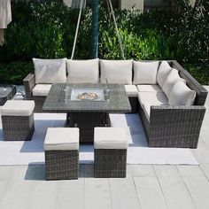 an outdoor patio furniture set with white cushions