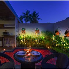 an outdoor patio decorated with lights and decorations