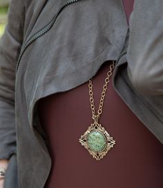 Elevate your style with our Aspen Green Serpentine Golden Necklace. The genuine green serpentine stone and bronze accents add a touch of natural beauty to your look. The adjustable length of 28" - 30" and weight of 53 grams ensure a comfortable and secure fit. Pendant measures 3" length including bail and 2.5" in width. Own a unique statement piece today! Serpentine Description: Serpentine is a group of minerals known for their green, snake-like coloring and smooth, often waxy texture. It typically appears in shades ranging from pale yellow-green to deep forest green, and sometimes even has black or white veining. Serpentine is commonly found in metamorphic rocks and is used for ornamental carvings, architectural decorations, and occasionally in jewelry. Fun Fact: Serpentine is often assoc Serpentine Stone, Deep Forest Green, Green Snake, Metamorphic Rocks, Golden Necklace, Deep Forest, Pale Yellow, Fun Fact, Turquoise Sterling Silver