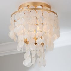 a chandelier hanging from the ceiling in a room