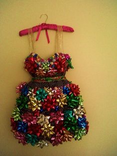 a dress made out of christmas bows with the words 15 surprisingly silly christmas outfits