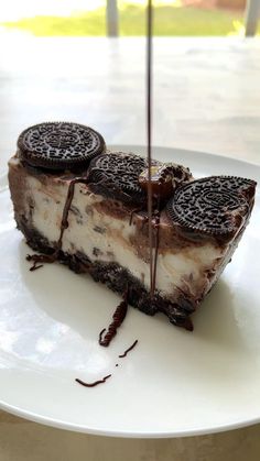 an oreo cookie cheesecake on a white plate