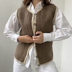 "A gorgeous vest, hand-knitted. Unlined  MATERIAL: 100% wool SIZE: S, also fits M CONDITION: Excellent  condition! M E A S U R E M E N T S ✂ Taken one-sided, laying flat. DOUBLE for Chest ✩ Shoulders: 35 cm/ 13,7 \" Chest : 95 cm / 37,4 \" Length: 60 cm / 23,6\"" Cozy Wool Sweater Vest For Winter, Fitted Winter Sweater Vest, Fitted Sweater Vest For Winter, Brown Knitted Sweater Vest For Winter, Fitted Knit Vest For Winter, Cozy Fitted Cable Knit Sweater Vest, Brown Knitted Sweater Vest For Layering, Brown Wool Sweater Vest For Workwear, Knitted Vest For Fall