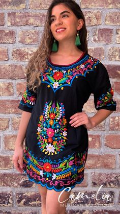 Cute Mexican Mini Dress with a detailed flower silk embroidery. Embroidery detail around sleeve, hem line and frontal floral design. With tie back for a perfect fit. Made of 100% cotton, manta (Musin) fabric. Embroidery color pattern may differ from one pictured. Match it with one of our Mexican Accessories: Espadrilles, Necklace, Shawl or Mexican Clutch. Perfect for any Mexican Themed party celebration. Look at our entire Dress Collection here. SIZE CHART: MEXICAN MINI DRESS WIDTH BUST LENGTH S Mexican Theme Party Outfit, Mexican Accessories, Mexican Quinceanera Dresses, Mexican Wedding Dress, Pattern Outfits, Gala Outfit, Mexican Party Theme, Party Outfits For Women, Mexican Blouse