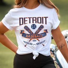 Please read the description completely and review all photos before ordering. Our Detroit Baseball Apparel is the perfect way to cheer on the home team this season. Ideal for game day, tailgates or everyday wear. Makes a great gift for any fan. This listing is for the distressed design. Click the link below for the non-distressed version: https://tandtapparel21.etsy.com/listing/1672213846/vintage-style-detroit-baseball-t-shirt SHIRT DETAILS Bella Canvas Unisex - Solid colors: 100% Cotton. - Heather colors: 52% Cotton + 48% Polyester - Runs true to size. (For looser or oversized fit consider going up a size or 2. See photos for size chart.) SWEATSHIRT & HOODIE DETAILS Gildan Heavy Blend Unisex - 50% Cotton + 50 Polyester - Runs true to size. (For looser or oversized fit consider going up a Baseball Apparel, Hoodie Details, Baseball Outfit, Sports Hoodies, Baseball Fan, Home Team, Sweatshirt Hoodie, Baseball Tshirts, Game Day