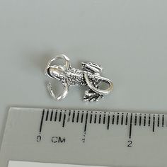 An open ended sterling silver gecko ear cuff/clip. Dimensions: 11.5 x 16mm Weight: 2gm Price listed is for ONE PIECE These are made of 925 hypoallergenic sterling silver. Most of my pieces come with a 925 stamp. Can be packaged in a gift box. I can include a personal message from you if needed You are welcome to contact me at... bhavnakwintra1956@gmail.com For more beautiful pieces from my shop, please browse 👇 TOE RINGS: https://www.etsy.com/your/shops/TheSilverGame/tools/listings/section:2702 Silver Clip-on Metal Cartilage Earrings, Silver Minimalist Clip-on Ear Cuff, Adjustable Silver Single Clip-on Earring, Adjustable Silver Clip-on Cartilage Earrings, Minimalist Adjustable Silver Clip-on Earrings, Silver Clip-on Cartilage Earrings As Gift, Silver Clip-on Cartilage Earrings For Gift, Adjustable Nickel-free Silver Piercings, Unique Adjustable Silver Ear Cuff