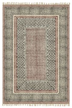 a rug with an intricate design and fringes