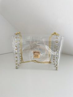 "Please note: We are safe and we fulfill the order as normal, in accordance with the declared deadlines. Clear deluxe bag, transparent glam handbag, vinyl clear bag, premium unique clear bag, transparent purse with chain, mass parties purse Dimensions: 21 x 18 x 11 cm /  8,26\" x 7,01\" x 4,33\" Made of thick, crystalline, flexible PVC, 100% vegan bag! You can use it for shoulder and crossbody. Medium transparent handbag with solid straps to my fascination with the universe transparent .You can complete your harmony as putting some compatible things with your daily dress into the transparent bag and you are ready to go! It's also good when going through airport security. This is no ordinary handbag :) Unconventional addition to the date, wedding, unusual styling to each highlighting your p Trendy Plastic Bag As Gift, Trendy Shoulder Bag With Clear Strap, Plastic Shoulder Bag, Trendy Shoulder Bag With Dust Bag Included, Plastic Satchel Shoulder Bag, Rectangular Plastic Shoulder Bag With Clear Strap, Trendy Plastic Shoulder Bag For Party, Trendy Bags With Clear Strap, Luxury Clear Bags For Everyday Use