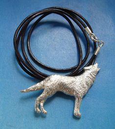 WOLF SILVER PENDANT This pendant Wolf is finely carved and illustrates the wolf in a typical gesture where is howling, perhaps to the moon... dimensions of the pendant silver wolf: 3 cms x 2.4 cms available with silver cord or with leather cord adaptable in length by sliding knot leather cord included MAGIC PROPERTIES OF THE WOLF SYMBOL (for the silver wolf pendant) The wolf pendant is a good amulet for cultivating inner wisdom. Wolf amulets give confidence and desire for freedom, or to balance Silver Wolf Pendant Necklace, Silver Wolf Design Round Pendant Necklace, Silver Necklace With Wolf Design Round Pendant, Silver Round Pendant Necklace With Wolf Design, Silver Wolf Design Symbolic Jewelry, Sterling Silver Wolf Design Jewelry, Symbolic Silver Wolf Design Jewelry, Silver Symbolic Wolf Design Jewelry, Silver Wolf Design Pendant Necklace