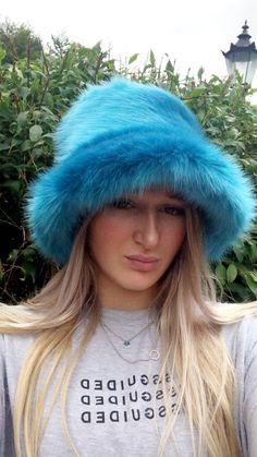 💥My hats are made by me and shipped to you WITHIN 3 days of receiving your order!Welcome to my fluffy shop where absolutely everything is made by me in England!  So because I make everything, any head size can be accommodated for, no worries at all! The standard size will fit heads approx 22- 23.5 inches, but if you want me to make a larger or smaller one, please add a measurement when ordering. Or message me your size.A beautiful super luxury faux fur in this stunning Peacock Blue. Very soft shiny short pile. Hat fits heads approx 21.5 -23 inches but I can make one larger or smaller if you like. The added bonus with my hats is that the polar fleece lining is water resistant, so great if caught in a downpour! All handmade by me in Lancashire! Gertrude Mcfuzz, Fuzzy Headband, Rave Hats, Trio Costumes, Fuzzy Bucket Hat, Fluffy Bucket Hat, Blue Bucket Hat, Fur Bucket, Faux Fur Bucket Hat