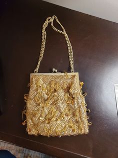 Chain strap, clasp closure. Elegant Gold Shoulder Bag, Beaded Shoulder Bag As Fashion Accessory, Chic Beaded Shoulder Bag For Party, Gold Beaded Bag For Events, Gold Beaded Bags For Events, Rectangular Gold Evening Bag, Elegant Rectangular Bags With Gold Beads, Embellished Crossbody Shoulder Bag For Party, Elegant Rectangular Gold Beaded Bags