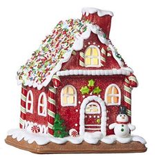 a red and white gingerbread house ornament