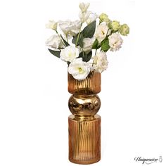 a gold vase with white flowers in it