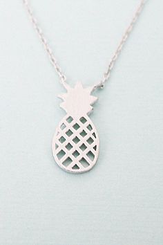 "Beautiful and lovely silver color tiny Pineapple pendent necklace. Made of fine quality silver plated chain and tiny Pineapple charm. Simple and soft. Perfect paired with any outfit. ❤ Pineapple Pendent is 1/4\" x 5/8\" ❤ Necklace 16 .5 \" CAUTION - We do not recommend to buy it if you have allergic and sensitive skin - Do not wear it taking shower ,to the pool, spa, or the beach - Remove when you sleeping, exercising, - Avoid contact with perfumes, body oils, and other chemicals, - Store your Trendy Silver Charm Necklaces For Gifts, Cute Silver Pendant Charm Necklace, Cute Hypoallergenic Silver Charm Necklaces, Silver Charm Necklaces With Delicate Chain For Birthday, Cute Silver Charm Necklaces For Everyday, Cute Silver Hypoallergenic Necklace, Trendy Silver Hypoallergenic Charm Necklace, Silver Necklaces With Delicate Chain For Birthday, Trendy Hypoallergenic Silver Charm Necklace