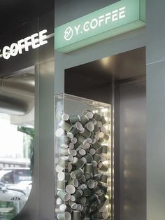 a display case filled with lots of coffee cups