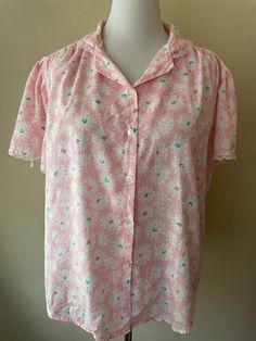 "Vintage 80s pink button up shirt, lace embroidered collar and sleeves. Made by Diamond Hill, marked size 42. Polyester cotton blend. Pink with white floral pattern, teal, purple and dark pink accents.  Please ask questions!  Measurements (laid flat):  Tag Size: 42 Length: 23\" Pit to Pit: 24\"x2 Waist: 25\"x2 Condition: Good vintage condition, no issues noted.  The vintage pieces I sell have all led a previous life and may tell their stories through minor imperfections. I'll do my best to indicate overall condition, but please refer to the pictures. Your purchase continues the life of this garment...what stories will you tell while wearing it?  Please note there may be a slight difference in color when comparing the actual garment to the monitor image. (0466)" Pink Lace Trim Blouse, Pink Collared Cotton Blouse, Feminine Pink Collared Top, Pink Floral Print Button-up Shirt, Pink Button-up Shirt For Daywear, Pink Button-up Tops For Daywear, Pink Collared Top With Button Closure, Lace Collar Button-up Shirt For Daywear, Pink Buttoned Shirt For Daywear