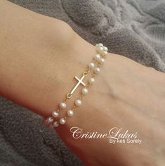 Sideways Cross Bracelet With Pearls - Double String Pearl Bracelet - Freshwater Pearl Bracelet in Sterling Silver, Yellow Gold or Rose Gold by CristineLukas on Etsy https://www.etsy.com/listing/498580566/sideways-cross-bracelet-with-pearls Elegant Cross Rosary Bracelet As Gift, Elegant Rosary Bracelet With Cross For Gift, Elegant Cross-shaped Beaded Bracelets As Gift, Elegant Cross-shaped Beaded Bracelets For Gift, Elegant Cross Beaded Bracelets As Gift, Elegant White Cross Bracelets, Elegant White Cross Bracelet, Elegant Cross Rosary Bracelet For Wedding, Elegant Cross-shaped Rosary Bracelet For Wedding