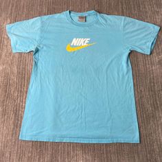 Vintage 2000s Nike Swoosh Check Sportswear Athletic Y2K Aesthetic Streetwear Blue Graphic T Shirt Large Mens Condition:  Excellent Used Condition  = No Flaws Measurements: Please see photos above for all measurements IF YOU BUY TWO OR MORE ITEMS USE THE CODE BUNDLE @ CHECK TO SAVE 20% WE SHIP WITHIN 24 HOURS AFTER PURCHASE! Please be aware that we do not offer free returns!! The Buyer is responsible for the cost of the return label. Follow us on TikTok & Instagram @findsnostalgic and tag us in your finds Blue Moisture-wicking Sportswear T-shirt, Blue Sportswear T-shirt For Sports Season, Blue Crew Neck T-shirt For Sports Season, 90s Style Short Sleeve Sports T-shirt, Blue Cotton Workout T-shirt, Blue Cotton T-shirt For Workout, Blue Sportswear T-shirt With Letter Print, Blue Sportswear Tops For Sports Events, Blue Short Sleeve Sportswear Top