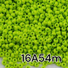 neon green plastic beads with holes in the middle for making beaded bracelets or necklaces