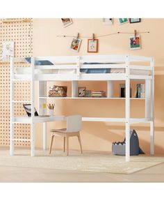 a white loft bed sitting next to a desk with a chair on top of it