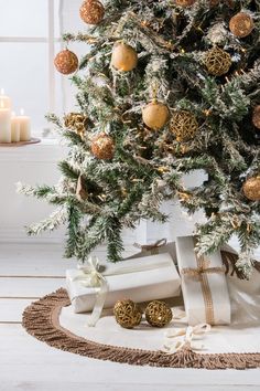 a christmas tree with presents under it