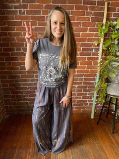 Add a pop of color and boho vibes to your wardrobe with our these Tie Dye Wide Leg Palazzo Pants. These flowy tiered pants can be dressed up or down for any occasion. Don't be afraid to get creative with your style! Free Size, will fit sizes up to an XL best Waist 24-36", Inseam 26", Front/Back Rise 16", Length 42" Hips: up to 50" Rayon Fair Trade made in Nepal Handwash or machine wash delicate Air Dry/Tumble Dry Low Please take a moment to look over all shop policies before purchasing. Casual Boho Print Pants For Festivals, Casual Boho Print Pants For Spring, Casual Boho Print Festival Pants, Casual Boho Print Harem Pants For Vacation, Casual Wide Leg Boho Print Harem Pants, Casual Boho Print Wide Leg Harem Pants, Bohemian Relaxed Fit Harem Pants, Flowy Boho Print Bottoms For Spring, Flowy Casual Bottoms With Boho Print